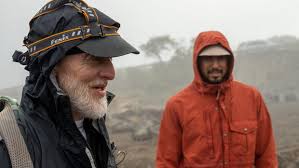 Duo descends to the ocean's depths in order to ascend the world's tallest  mountain