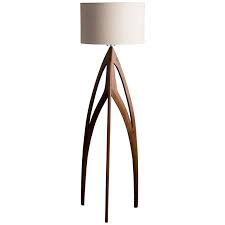 And, speaking of bases, the effortlessly cool appearance of acrylic tripod floor lamps certainly stands out. Walnut Tripod Floor Lamp With Sculptural Piercing For Sale At 1stdibs