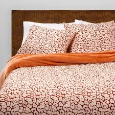 Sleeping in the romantic bedroom offers a warm and inviting atmosphere. Red Bedding Sets Target