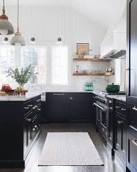 Black And White Kitchen Ideas Small Gorgeous Kitchen With Black Cabinets Gold Hardware Open Shelving And Lots Of Natural Light Kitchen Remodel Small White Kitchen Remodeling Kitchen Design
