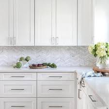 For kitchen backsplashes and bathroom and shower floors/walls. Thin White And Silver Marble Herringbone Kitchen Tiles Transitional Kitchen