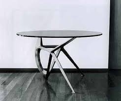 The contemporary round santiago coffee table features black metal accents and elegant tapered wood legs. Pin On Santiago Calatrava