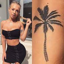 This amazing tattoo design looks unique because of its slender trunk and different kind of foliage. 9 Celebrity Palm Tree Tattoos Steal Her Style