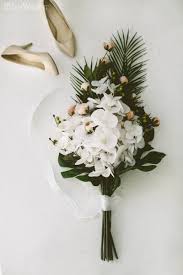 Wedding flowers will take up a sizable portion of your budget, so work with a pro who understands you don't need a destination wedding to decorate with tropical flowers. 25 Best Tropical Wedding Bouquets Ever Weddinginclude