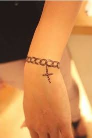 A tattoo that runs from the wrist down. Ribbon Chain And Crosses Temporary Tattoo Jewelry Necklace And Bracelet Set Chain Tattoo Bracelet Tattoos With Names Wrist Tattoos For Women