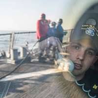 Lt. Andre Lanier, left, explains to Commander, Multinational Division South  East, British Maj. Gen. J. B. Dutton, the purpose of the ouiji board in  Flight Deck Control.