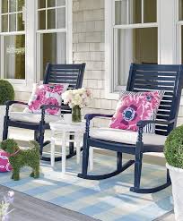 Two Dark Blue Rocking Chairs Pink Floral Throw Pillows Front Porch Ideas Green Bushes Flower Vase Front Porch Chairs Rocking Chair Porch Front Porch Furniture