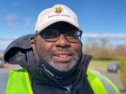 On a chilly, windy day, volunteers hand out coats in DC