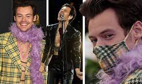 Harry styles attends the grammys wearing three feather boas, multiple suits and even goes shirtless for his opening performance. Uokquyp3k3dr3m
