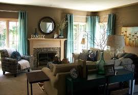 Does the outside of your home need a bit of a refresh? Living Room With Green Accents Green Accents In A Brown Living Room Brown Living Room Decor Teal Living Rooms Taupe Living Room