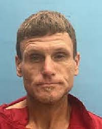 Cops: Man broke out of police car