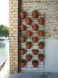 A vertical garden is simply a growing space that makes use of the vertical as well as the horizontal plane. Vertical Garden Plant Stand Vertical Garden Plants Garden Plant Stand Vertical Garden