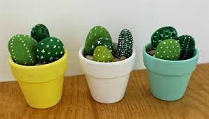 In this next idea, the white building in the background is bright in the desert sun, but the contrast of the tall green cactus plants creates a charming atmosphere that is perfect for your garden. Diy Cactus Rock Painting Ideas Balcony Decoration Eco Friendly Garden Ideas