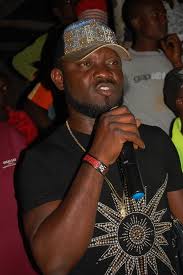 Sir Eric Abu presenting trophy to Galadima fc the winners of G fox cup 2016.