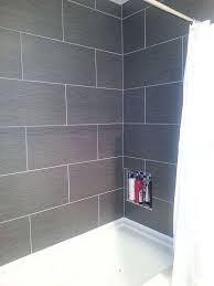 Painted chipboard has been used as the facade of this platform. Small Master Bathroom Makeover Master Bathroom Makeover Small Master Bathroom Tile Tub Surround