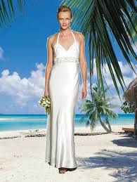 The tulle layer shows a cut in the thigh at the base of the skirt and is a great alternative to the classic bridal look. Get Inspired For Simple Beach Wedding Dresses Wedding Inspiration