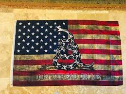 The gadsden flag is a historical american flag with a yellow field depicting a timber rattlesnake coiled and ready to strike. Badass Flags For Sale Us Patriot Flags
