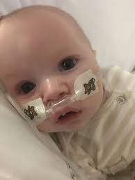 Couple rushed forward their wedding to give baby boy with brain tumour the  family name before he died in their arms