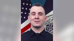 NYPD officer killed by friendly fire during confrontation with armed  suspect
