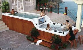 The World S Coolest Hot Tub The Two Tiered Jacuzzi Which Comes With Its Own Bar Flat Screen Tv And Inbuilt Sound System My Dream Home Hot Tub Dream House