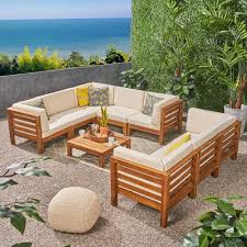 Noble House Jonah Teak 9 Piece Wood Outdoor Sectional Sofa Set With Beige Cushions 307083 The Ho Teak Patio Furniture Wood Patio Furniture Backyard Furniture