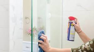Spray a little bit of the cleaner on a small area of your shower door, then wipe it off with a clean cloth. 11 Tips To Clean A Glass Shower Door