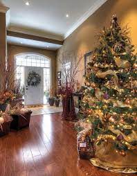 A collection of black and white artwork adds personality to this brand new home. 50 Fresh Festive Christmas Entryway Decorating Ideas