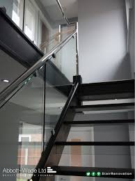 An Open Tread Black Oak Staircase With Steel Rail Glass Balustrade Glass Rise Stainless Steel Staircase Staircase Glass Design Stainless Steel Stair Railing