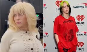 Eilish's bright blond hair, however, was not to be missed. Billie Eilish Bleaches Black And Green Locks Blonde As She Swaps Baggy Clothes For Tight Cardigan Daily Mail Online