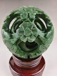 A fascinating and incredible piece of artistry and workmanship. Exquisite Mystic Green Jade Dragon Puzzle Ball 4 Inch