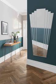 The thin profile of the iron frame features a black finish that fits beautifully on feature walls in formal and casual rooms. Cannes Large Art Deco Fan Style Glass Mirror Ayers And Graces