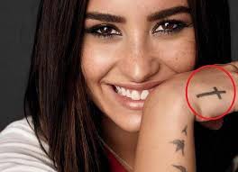 Born under the sign of leo, the singer demi lovato has a lion's face tattooed on her right hand. Demi Lovato S 20 Tattoos Their Meanings Body Art Guru