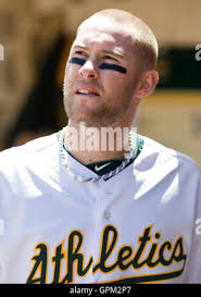 Oakland Athletics first baseman Daric Barton (10) reaches for the throw as  Texas Rangers' Robinson Chirinos (61) makes it safely to first