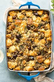 Overhead Photo Of Baked Roasted Chestnut Stuffing In A Blue Baking Dish With Glasses Of Wine An Sausage Cornbread Stuffing Chestnut Recipes Vegetarian Stuffing