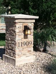 A variety of materials are available when choosing mailbox numbers. Stone Pillar With House Numbers On It Home Entry Pillar With House Numbers Stone Pillars Driveway Entrance Landscaping Stone Driveway