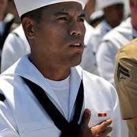 Master Chief Culinary Specialist Moises Lovinaria and Culinary Specialist  2nd Class Lyndsee Pereyra perform the Tinikling, a Filipino folk dance,  during the Asian-American Pacific Islander Heritage celebration.