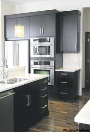Sink base cabinet has 2 wood drawer boxes that offer a wide variety of storage possibilities. Let There Be Light Winnipeg Free Press Homes Dark Kitchen Cabinets Espresso Kitchen Cabinets Kitchen Design