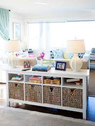 The cubbies can hold books, puzzles, board games, etc., and you can add pretty baskets to some of the cubbies to contain smaller toys like blocks and dolls. Child S Play Organizing One Toy At A Time Living Room Storage Home Home Decor