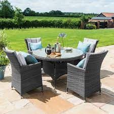 Enjoy the summer months with your friends and family eating outside. Margarita Grey Round Rattan Table Chairs Fishpools