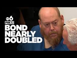 Man accused of killing deputy pleads not guilty to 14 counts, bond raised  to $9M