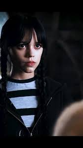 Interesting fact: In Wednesday, the stained-glass window in the girls’ dorm  room wasn’t just decorative — the production team designed it to subtly  mirror Wednesday’s personality, with sharp geometric ...