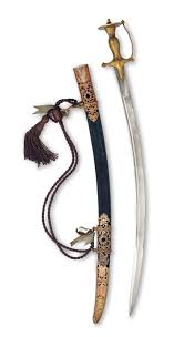 A brass-hilted steel sword (Tulwar ...