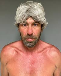 Pickup truck driver charged in motorcyclist's death