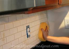 I'm a bit of a perfectionist and the idea of crooked tile or incorrect grout lines makes me a little crazy. Kitchen Diaries Subway Tile Backsplash Grout Day 2