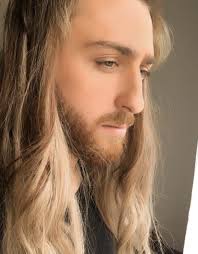 If you were born with curly hair, you should strongly consider ditching the flat iron and flaunting your ringlets with pride. Long Curly Hair Products For Men Guide Long Hair Guys