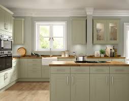The blue and green backsplash enhances the room's coastal. Somerset Olive Green Benchmarx Kitchens Joinery