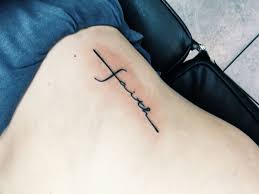 Faith tattoos are generally associated your faith in god, but these very popular tattoos are inked for many different reasons also. My First Tattoo A Cross On My Ribs With The Word Faith Incorporated Rib Tattoos For Women Meaningful Wrist Tattoos Tattoos For Women