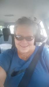 1956 image of four students shooting marbles at Harmar School