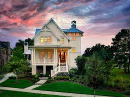 Nikole ramsay inspiration for a beach style bedroom in geelong with white walls, carpet and grey floor. Tour This Elevated Coastal Cottage In Charleston Sc Hgtv S Decorating Design Blog Hgtv