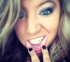 Bite me inner lip tattoo
